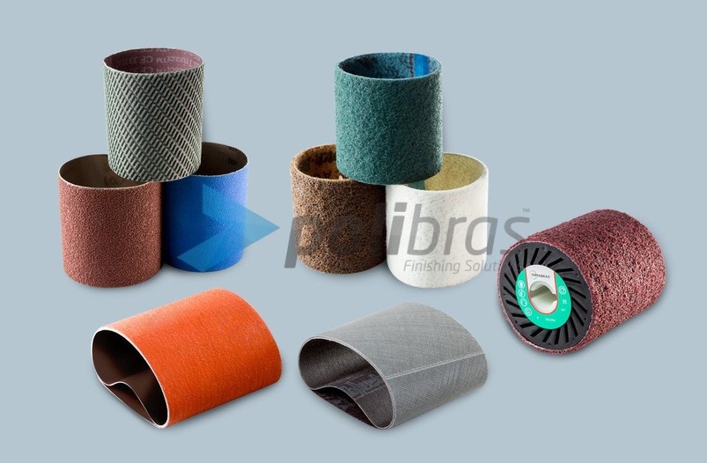 Cintas Abrasivas e Rodas de Contacto para máquinas Satinadoras. Cintas de Lixa e Surface Conditioning. Rodas Expansivas em borracha ou Vulkollan®.